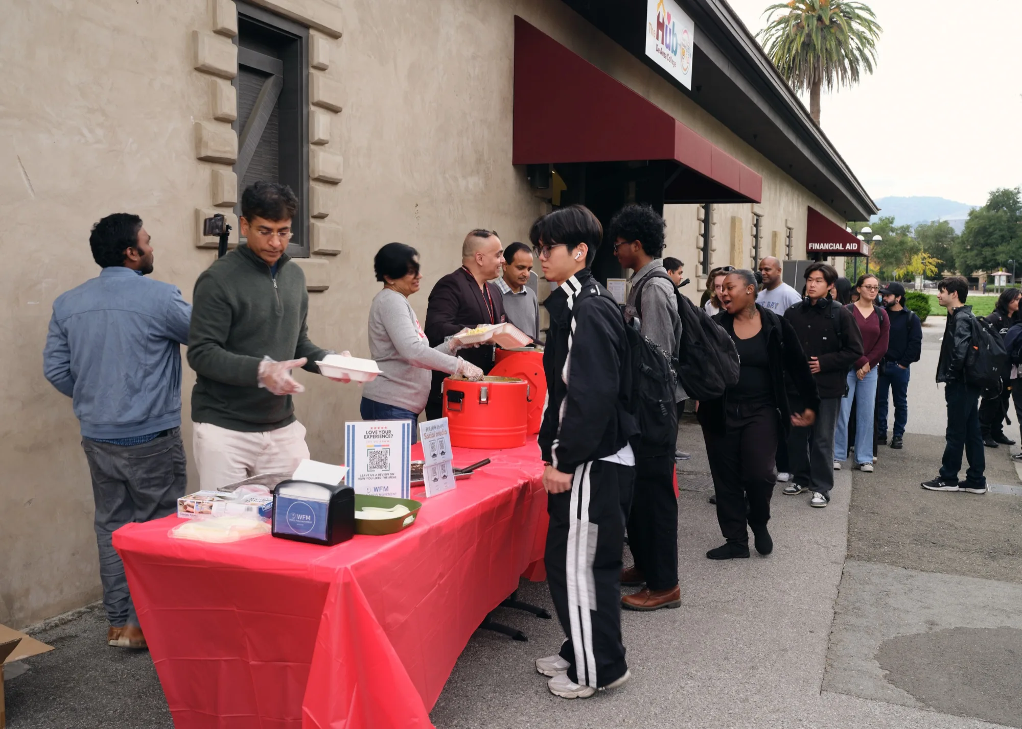 Students and staff gathered at a campus meal launch