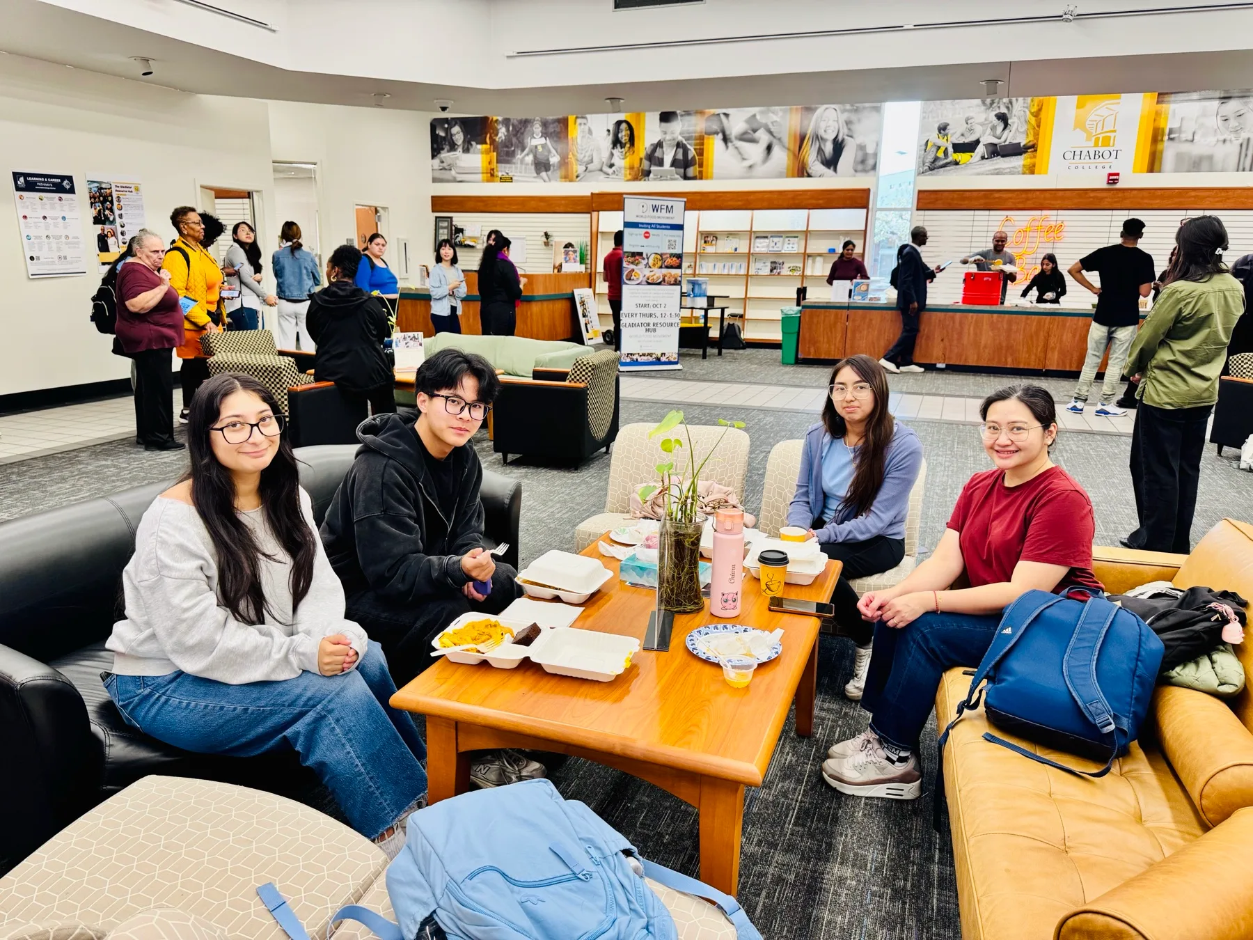 Students collecting freshly cooked lunches on campus