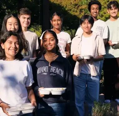 World Food Movement volunteers preparing meals for students